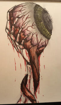 Child skeleton hand holding the eye